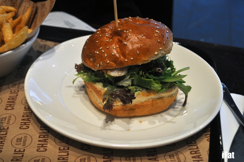 Fish of the Day burger featuring chargrilled fish of the day, mixed leaf lettuce,  pickled gherkins and aioli