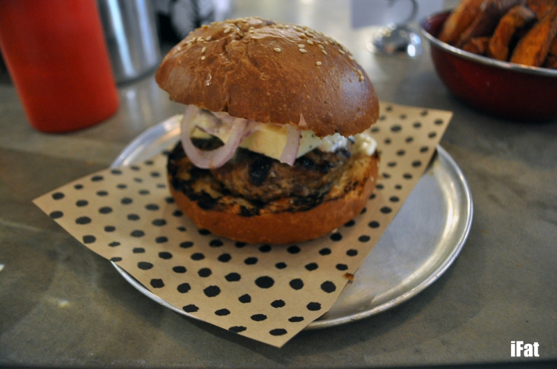 Grilled lamb burger with mint sauce, feta, red onion and aioli