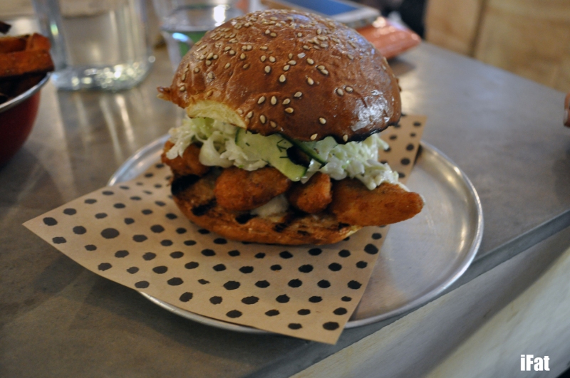 Crumbed fish fillet burger with pickled cucumber, lemon mayo and dill
