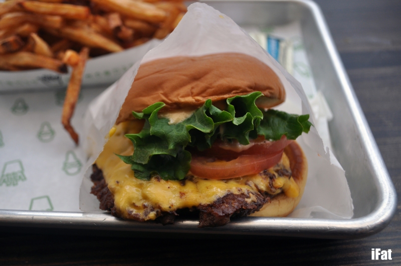 The Shackburger with tomato, lettuce, cheese and an incomparable patty