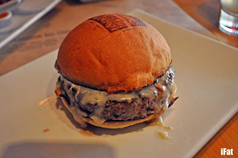 Truffle Burger. Umami's famous blend of beef with roasted garlic ailoi, house truffle cheese and truffle glaze.